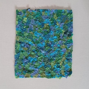 ocean green scrap fabric sewn from many small pieces offabric