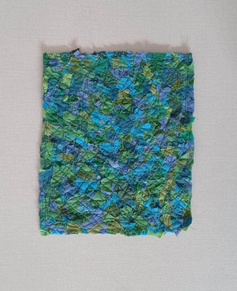 ocean green scrap fabric sewn from many small pieces offabric