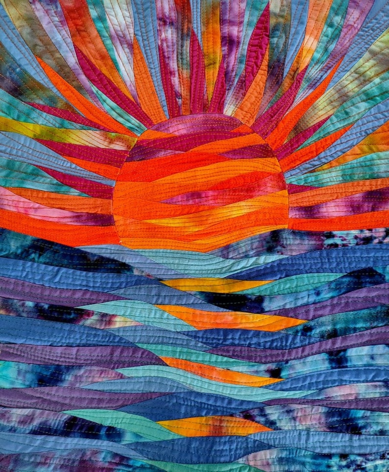 Patchwork sunset in evening colors, fuschia, red, pink orange and a blue turquoise sea below