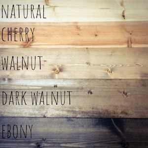 May include: Five wood samples stained in different colors: natural, cherry, walnut, dark walnut, and ebony.