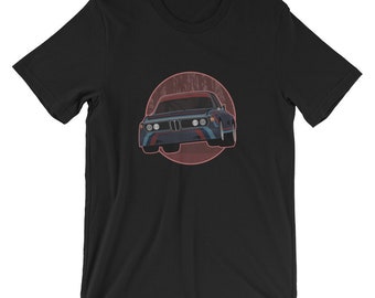 May include: Black t-shirt with a red circle and a blue and white race car in the center.