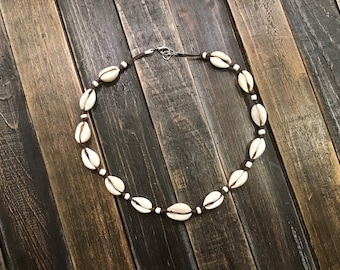 Cowrie shell, seed bead, tropical choker necklace.  Brown, white or black cord.