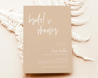 May include: A beige bridal shower invitation with white calligraphy that reads "bridal shower" and includes the details of the event: "Please join us as we celebrate Sieger Helluy August 28th, 20XX | 12:10pm Fig Tree Cafe 1441 Figueroa Street, Santa Cruz, CA Kindly RSVP to [phone number] Registered at [website]"
