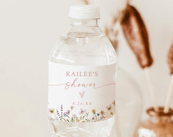 May include: A clear plastic water bottle with a white label that says "Kailee's shower" with a heart and the date "9.26.XX". The label has a floral design with pink, purple, and yellow flowers.