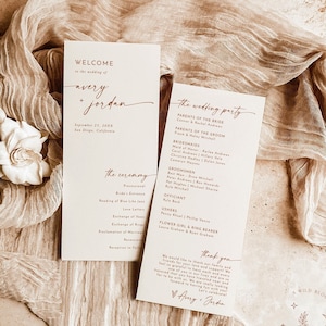 May include: Wedding invitation suite with a minimalist design. The invitation features a welcome message with the couple's names, Avery and Jordan, and the date and location of the wedding. The second card lists the wedding party and the ceremony details.