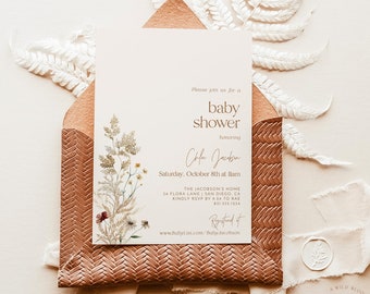 May include: A white baby shower invitation with brown text. The invitation reads "Please join us for a baby shower honoring Cola Jacobsen. Saturday, October 8th at 11am. The Jacobson's Home 34 Flora Lane San Diego, CA. Kindly RSVP by 9:34 to Rae 631.555.1234. Registered at www.BabyList.com/BabyJacobson"