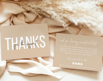 May include: Two beige thank you cards with white text. The first card says "Thanks for the support". The second card says "and for having sensational taste! We hope this package brightens your day as much as your order has with oursi to show our love + gratitude. Enjoy 15% off your next order with the code THANKYOUIS" and includes social media icons. The cards are on a beige fabric background with a dried pampas grass.