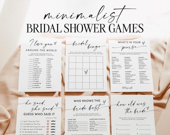 Puede incluir: Un conjunto de juegos minimalistas para la despedida de soltera en tarjetas blancas con texto negro. Los juegos incluyen "I Love You's Around the World", "Bridal Bingo", "What's in Your Purse", "He Said, She Said", "Who Knows the Bride Best" y "How Old Was the Bride".