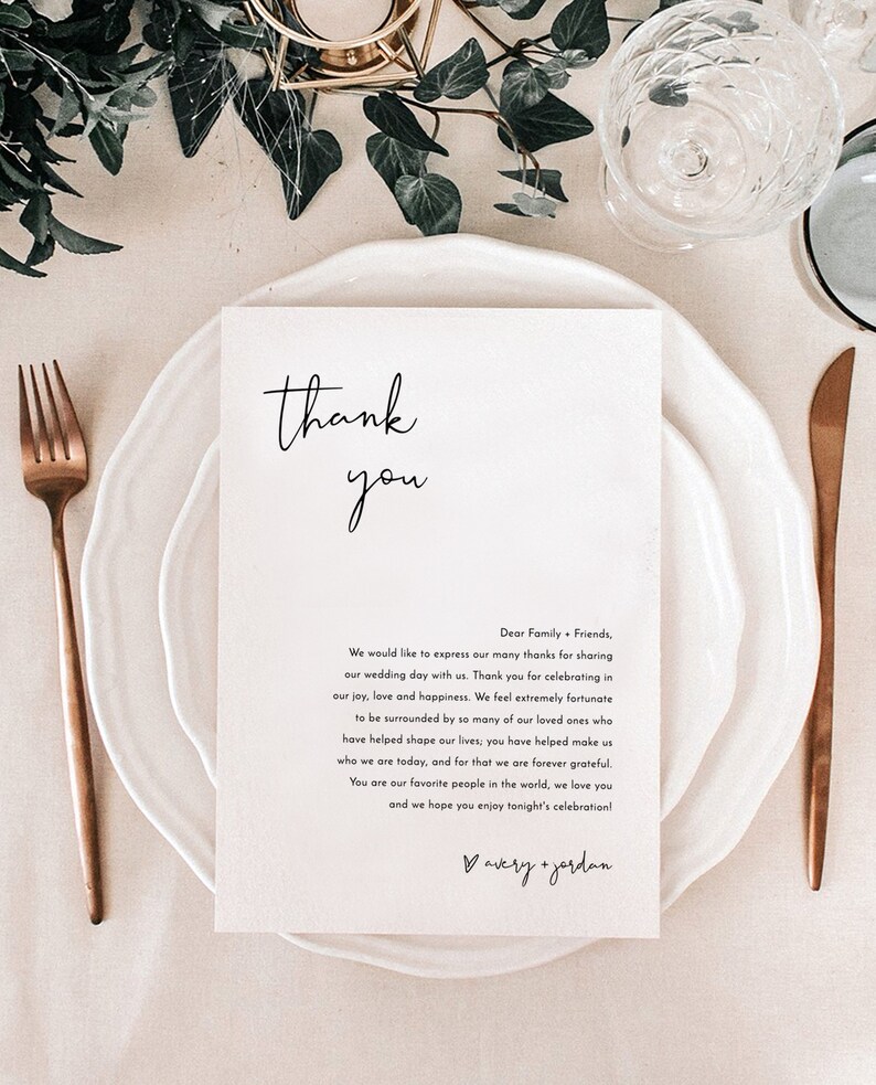 May include: A simple thank you card with a handwritten message expressing gratitude to family and friends for celebrating a wedding. The card is white with black text and a small heart with the names "avery + jordan" at the bottom.