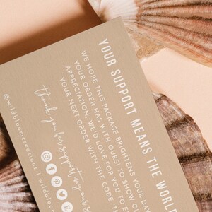 May include: A brown card with white text that reads "Your support means the world to us. We hope this package brightens your day as much as your order has with ours! To show our love and appreciation, we'd love for you to enjoy 15% off your next order with the code 'THANKYOU'. Thank you for supporting our small business."  The card also includes social media icons for Instagram, Facebook, Pinterest, Twitter, and Etsy.