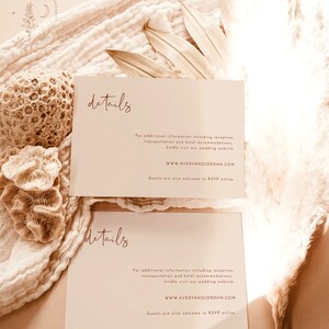 May include: Two cream-colored cards with the word "details" written in a cursive script in a reddish-brown color. The text on the cards provides information about a wedding, including the website address "WWW.AVERYANDJORDAN.COM" and instructions for RSVPing online.