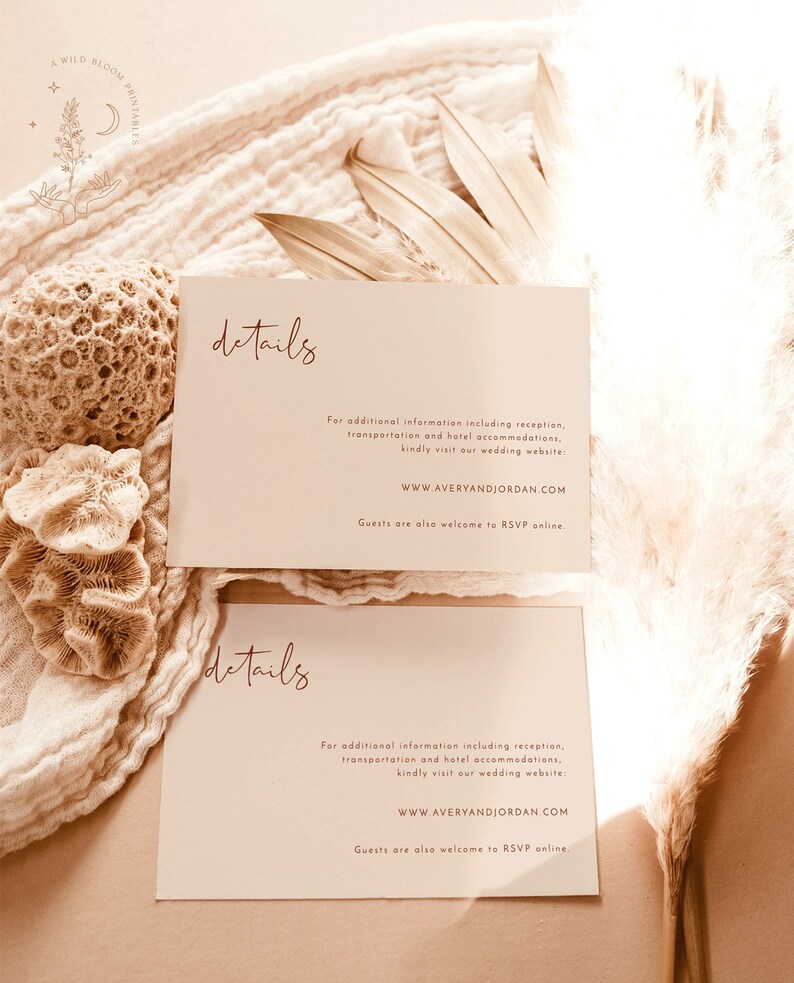 May include: Two cream-colored cards with the word "details" written in a cursive script in a reddish-brown color. The text on the cards provides information about a wedding, including the website address "WWW.AVERYANDJORDAN.COM" and instructions for RSVPing online.