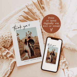 May include: A printable thank you card with a photo of a couple in a desert setting. The card has a simple design with the text "Thank you" in a handwritten font and the couple's names and wedding date at the bottom. The card can be printed or sent digitally via text or email.