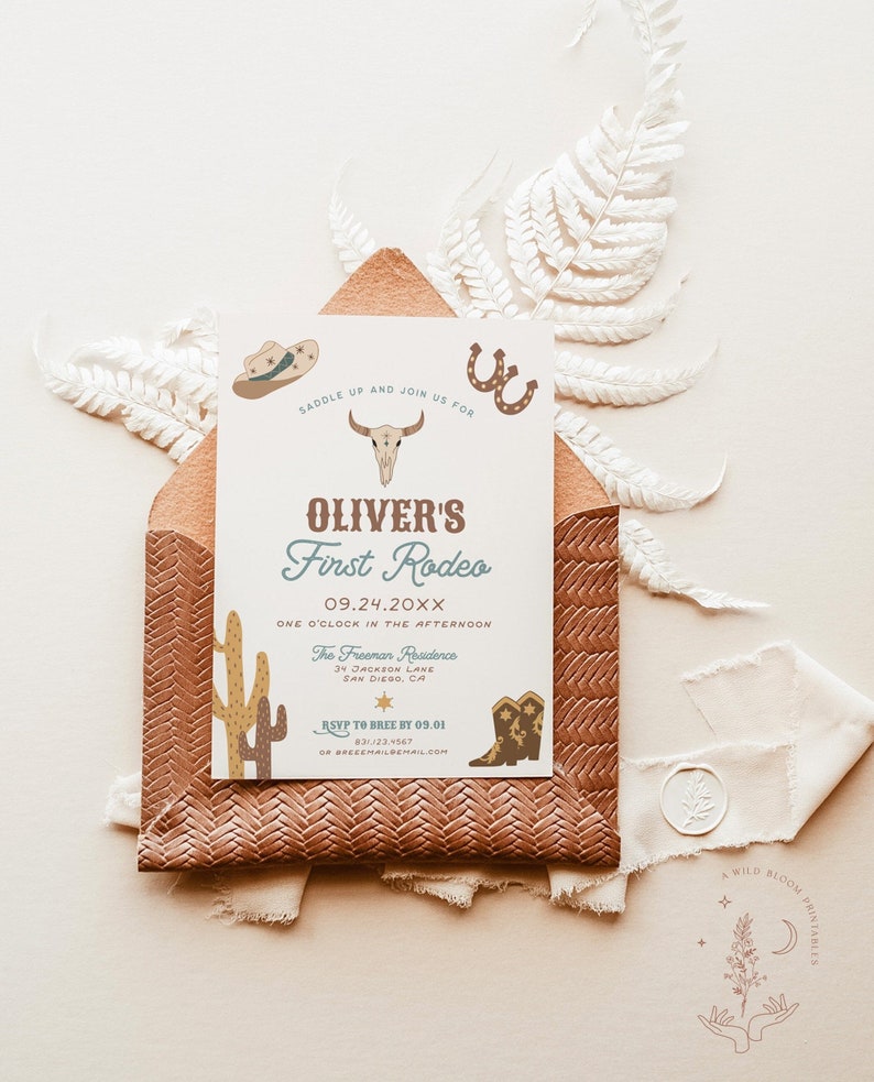 May include: A light blue and white invitation with a cowboy theme. The invitation says "Oliver's First Rodeo" with the date "09.24.20XX" and the time "One o'clock in the afternoon". The invitation also includes the location "The Freeman Residence, 34 Jackson Lane, San Diego, CA".