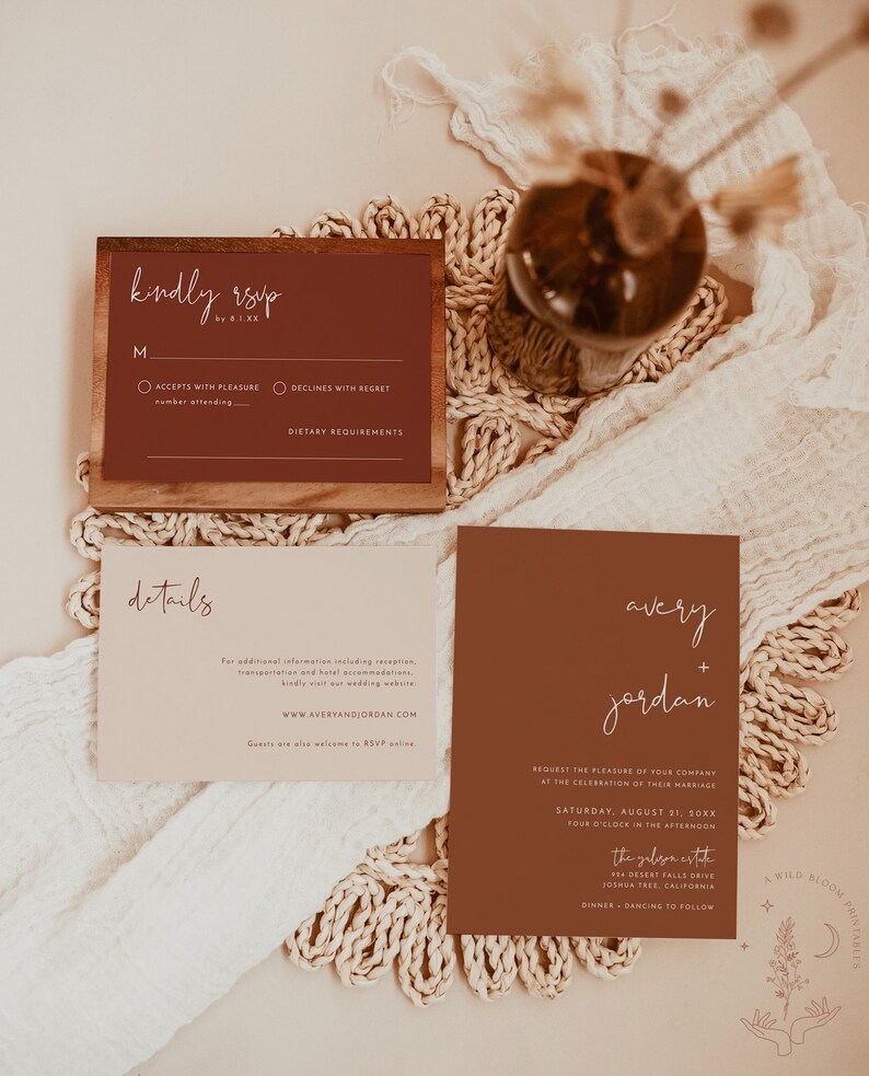 May include: A wedding invitation suite with a rustic theme. The invitation features a brown background with white text that reads "avery + jordan". The RSVP card features a brown background with white text that reads "kindly rsvp".