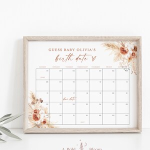 Puede incluir: Un juego de baby shower imprimible con un tema boho. El juego es un calendario con el texto "Adivina la fecha de nacimiento de la beb&eacute; Olivia" y un coraz&oacute;n. El calendario est&aacute; decorado con flores secas y hierba de la pampa.