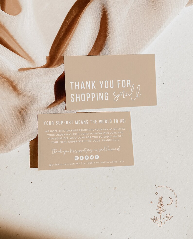 May include: Thank you for shopping small card with a beige background and white text. The card includes a message thanking customers for their support and offering a discount code for their next purchase. The card also includes social media icons and a website address.