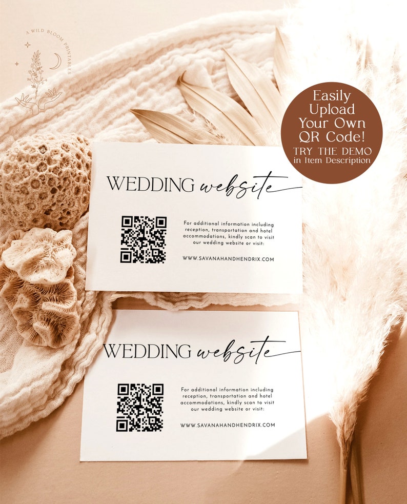 May include: Two white cards with black text that reads "WEDDING website". Each card features a black and white QR code and the website address "WWW.SAVANAHANDHENDRIX.COM". The top card has a brown circle with white text that reads "Easily Upload Your Own QR Code! TRY THE DEMO in Item Description".