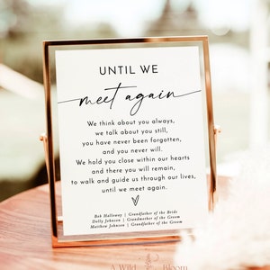 May include: A white sign with black text in a gold frame. The sign reads "Until we meet again." The text continues with a poem about remembering loved ones who have passed away. The sign is on a wooden table with a floral design.