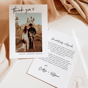 May include: A wedding thank you card with a photo of the couple in a desert landscape. The card has a simple design with black text on a white background. The text reads "Thank you" and "Dearest family and friends." The card also includes the couple's names and wedding date.