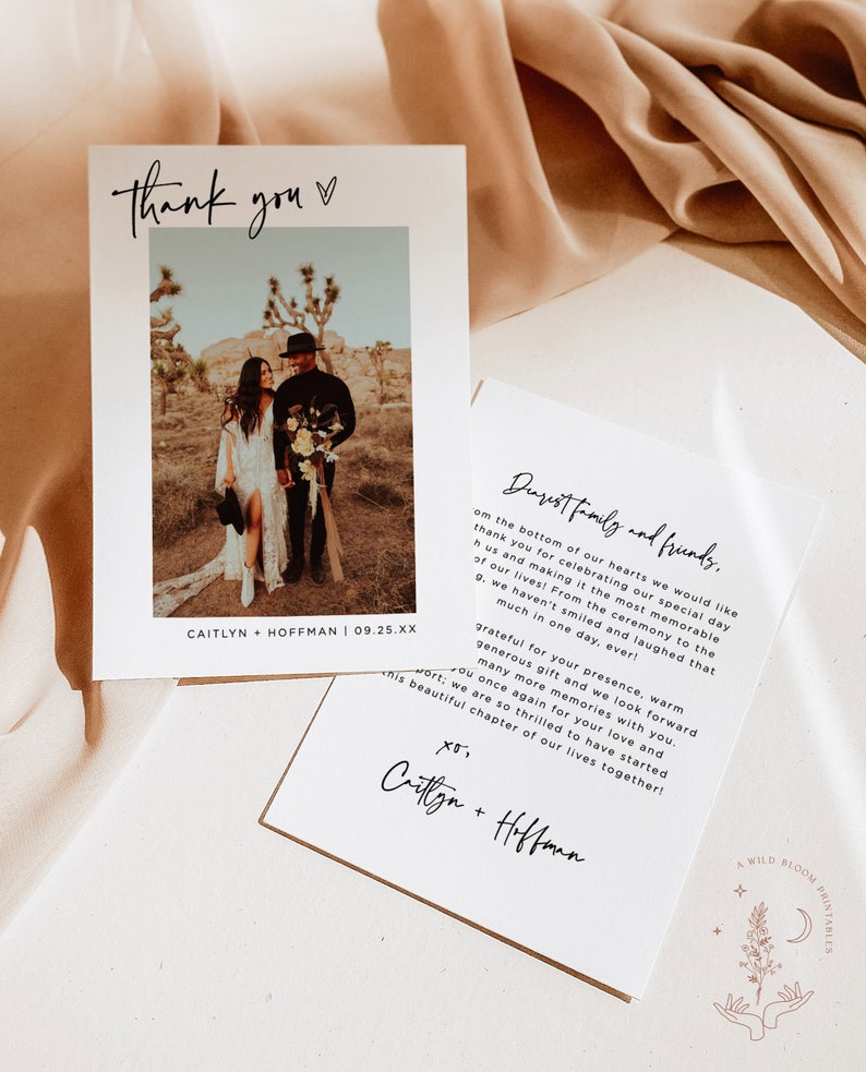 May include: A wedding thank you card with a photo of the couple in a desert landscape. The card has a simple design with black text on a white background. The text reads "Thank you" and "Dearest family and friends." The card also includes the couple's names and wedding date.