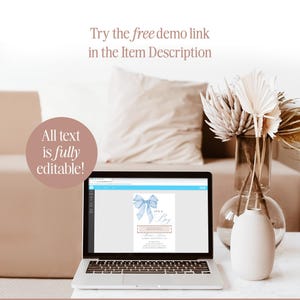 May include: A laptop computer displaying a baby shower invitation with a blue bow and the text "It's a Boy". The invitation is on a white background with a pink and white border. The text "All text is fully editable!" is displayed on the left side of the image. The text "Try the free demo link in the Item Description" is displayed at the top of the image.