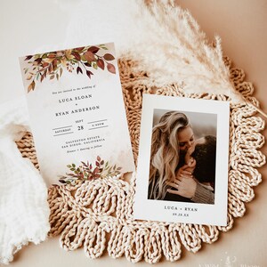 May include: A wedding invitation with fall foliage and the text "You are invited to the wedding of Luca Sloan + Ryan Anderson, Saturday, Sept 28, 4:00PM, Galveston Estate, San Diego, California, Dinner + Dancing to follow". A separate card with a photo of a couple kissing and the text "Luca + Ryan, 09.28.XX, A Wild Bloom Printables".