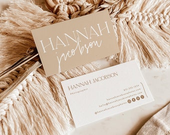May include: Two business cards with a beige background and white text. The top card says "HANNAH jacobson" and the bottom card says "HANNAH JACOBSON Photographer" with contact information including a phone number, email address, and social media links.