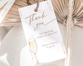 May include: Thank you for making today so special!  Olivia's Shower 9.24.XX.  A white card with brown text and a champagne glass illustration.