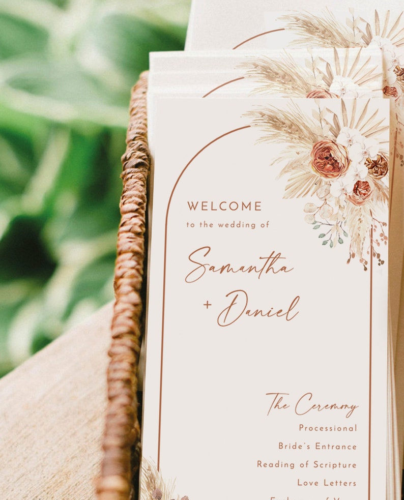 May include: A wedding ceremony programme with a beige background and a floral illustration. The text reads "Welcome to the wedding of Samantha + Daniel" and lists the order of the ceremony: Processional, Bride's Entrance, Reading of Scripture, Love Letters.