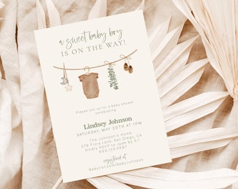 May include: A baby shower invitation with a watercolor illustration of a baby onesie, booties, and greenery hanging on a clothesline. The text reads "a sweet baby boy is on the way!" and includes the details of the shower, including the date, time, location, and RSVP information.