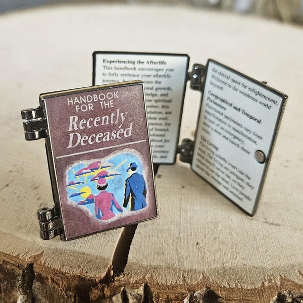 El pin de esmalte del manual