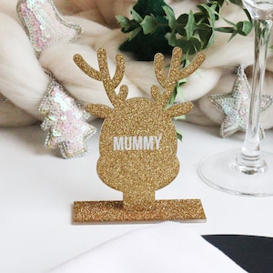Impostazione del luogo di Natale con renne d'oro personalizzate / Disposizione dei pasti scintillanti / Impostazione della tavola elegante / Nomi dei tavoli delle renne luccicanti