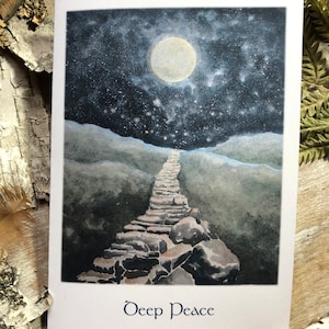 May include: A greeting card with a watercolor painting of a starry night sky and a full moon. A stone path leads up to the horizon. The words "Deep Peace" are printed at the bottom of the card.