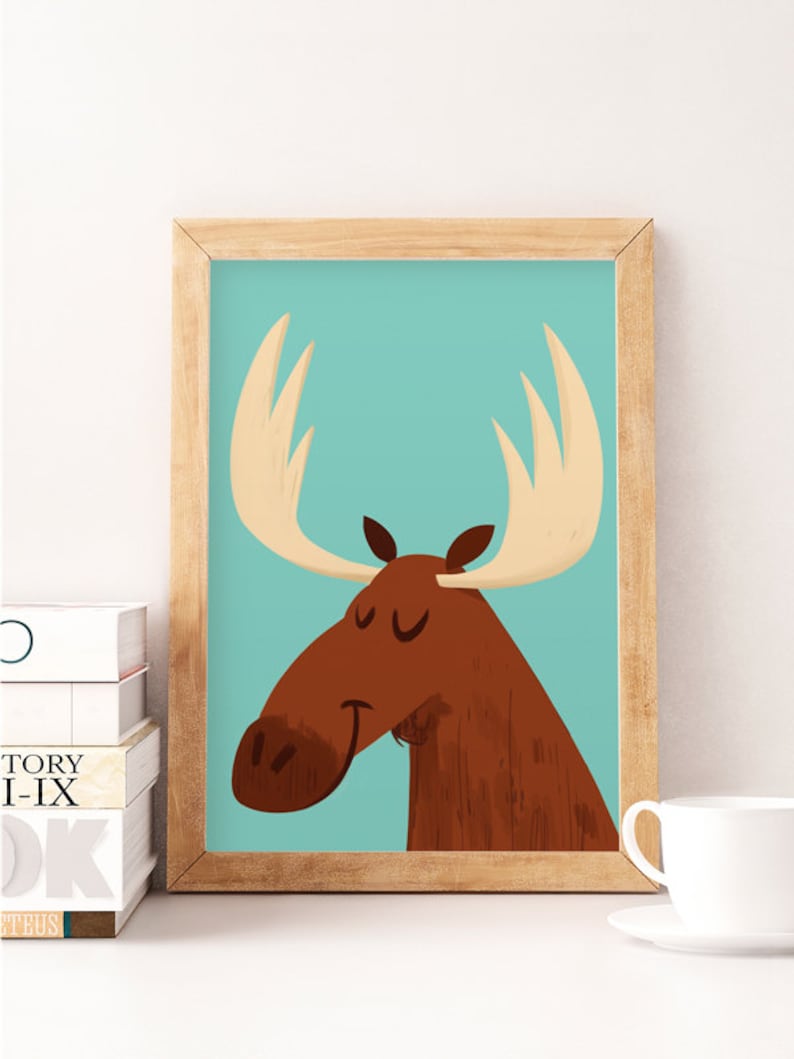 May include: A framed illustration of a brown moose with large antlers against a light blue background. The moose has its eyes closed and a gentle smile.
