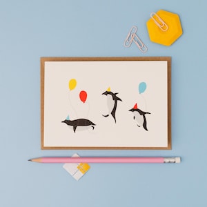 Penguin birthday party greetings card