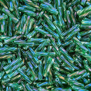 2.7 mm x 12 mm ツイストミユキビューグルビーズ - 透明グリーン AB - 10 グラム