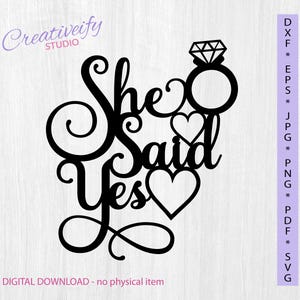 Puede incluir: Diseño recortado en negro con las palabras "She Said Yes" y una ilustración de un anillo de diamantes. Dos corazones están incorporados en el diseño. La imagen también incluye el texto "Creativity Studio" y "DIGITAL DOWNLOAD - no physical item".