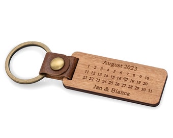 Keychain with calendar made of wood with many different motifs