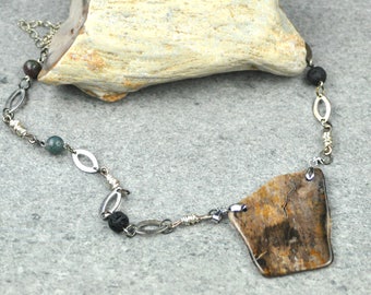 Petrified Wood Pendant Necklace. Petrified Wood Pendant necklace with agate and lava stone beads