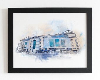 Puede incluir: Una pintura de acuarela de un gran edificio con un esquema de color azul y blanco. El edificio tiene muchas ventanas y un techo plano. La pintura está enmarcada en negro.
