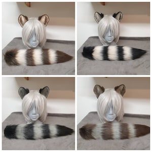 Può includere: Quattro diversi set di orecchie e code di animali in pelliccia sintetica. Le orecchie sono marroni e bianche, e le code sono marroni, bianche e nere. Le code sono tutte lunghe circa 50 cm.