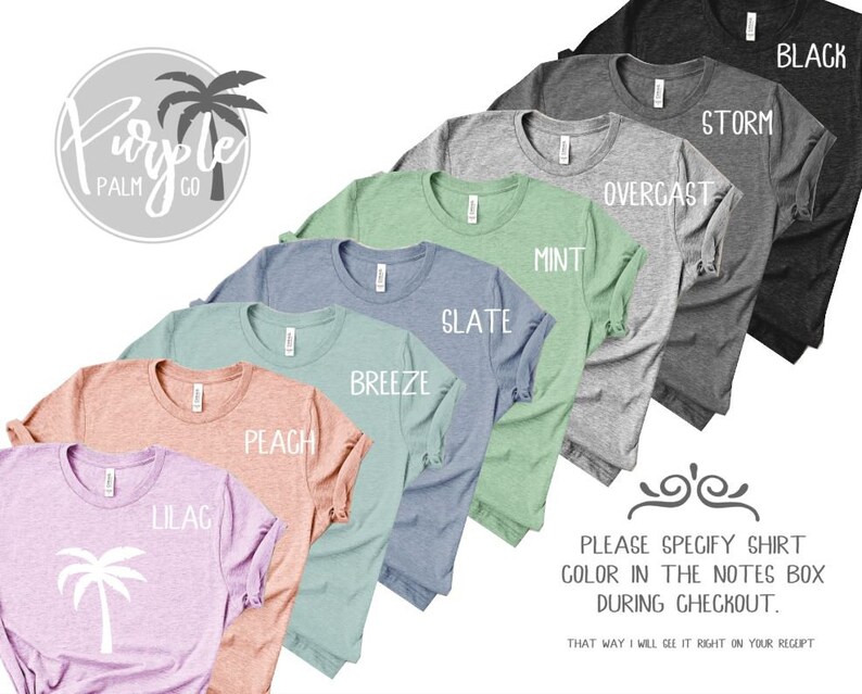 May include: A variety of t-shirt colors are displayed, including black, storm, overcast, mint, slate, breeze, peach, lilac. The text "Please specify shirt color in the notes box during checkout" is displayed below the shirts.