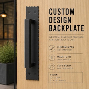 May include: A black custom design backplate with a handle, mounted on a wooden door. The backplate has a decorative, flame-cut edge. Text on the right reads "CUSTOM DESIGN BACKPLATE" and "INDUSTRIAL FLAME CUT EDGE LOOK. RAW. BOLD. BUILT TO LAST."