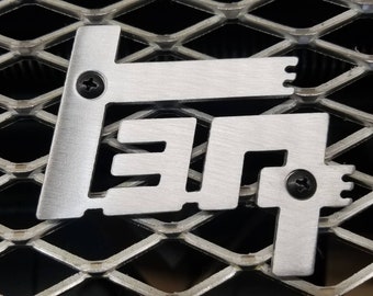 Universal Grille-Mount TEQ Logo in Aluminum