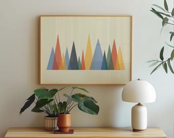 May include: A framed art print featuring a geometric mountain range design in shades of red, orange, blue, and yellow. The print is displayed above a wooden cabinet with potted plants and a white lamp. The text "high resolution, instant digital download" is at the bottom.