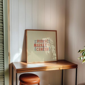 Illustration of Seattle, Washingtons iconic Public Market Center or Pike Place Market sign on a tan background
