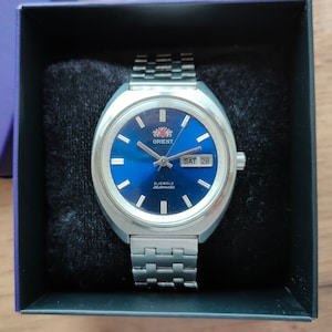 Rare Early watch Orient, blue dial, Original Japan watch, mechanical watch, date and day calendar.