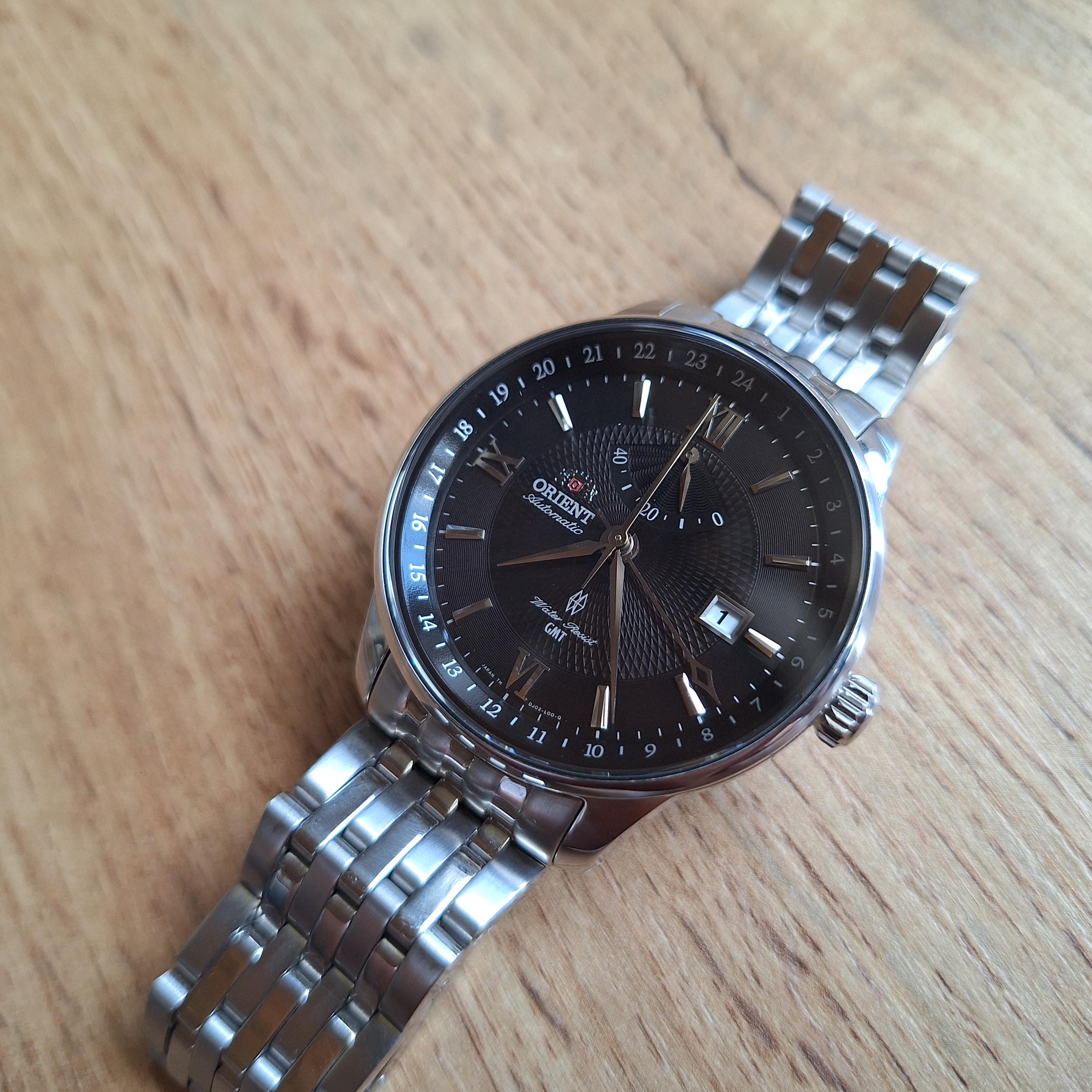 Orient GMT Automatic Watch: Power Reserve, 4 Hands, Black Dial 