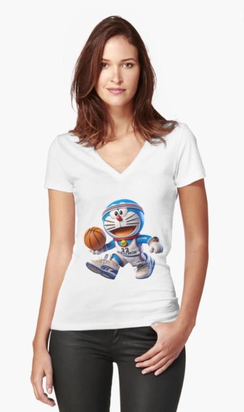 May include: White V-neck t-shirt featuring a cartoon character, Doraemon, in a basketball uniform, dribbling a basketball. The character is blue and white with a red nose and a blue headband. The shirt is worn by a person.
